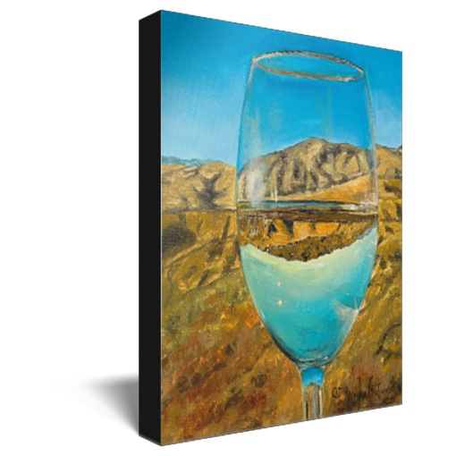 Archival print on canvas of a contemporary landscape painting of a glass of white wine refracting a summertime foothills landscape under a bright blue sky. 