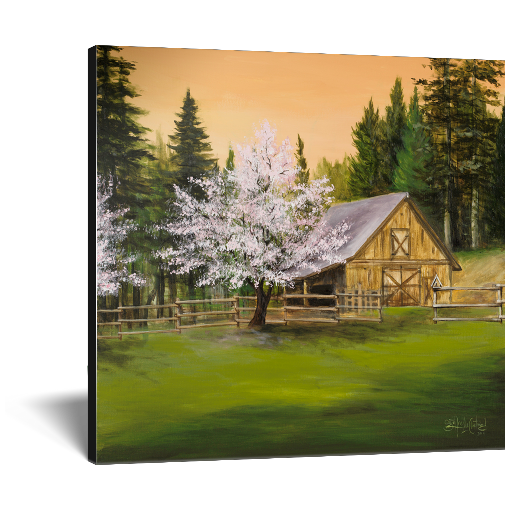 Archival print on canvas of a painting of a lush green mountain landscape, trees in spring blossom, and a rustic barn surrounded by evergreen pine trees under a soft peach colored sky. 