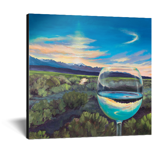 Archival print on canvas of a painting of a sagebrush landscape refracting in a glass of white wine under a blue evening sky with a mountain range on the horizon. 