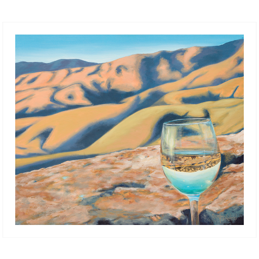 Archival print on canvas of a glass of white wine refracting sunlit foothills under a bright blue sky. 