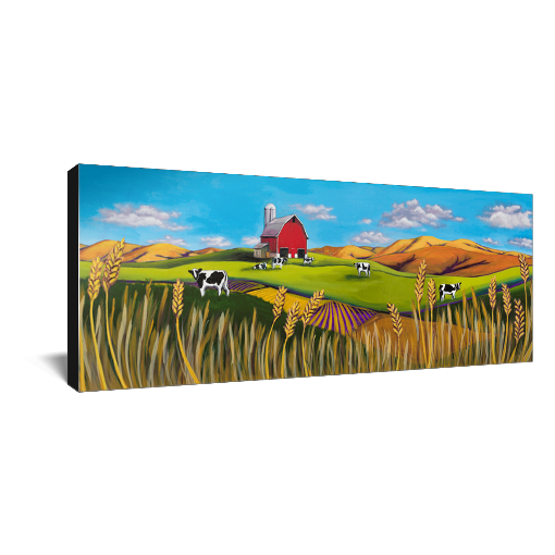 Archival print on canvas of a contemporary rural landscape painting of a red barn sitting in a green field with black and white dairy cows, wheat fields, and foothills under a bright blue sky with fluffy white clouds floating by. 