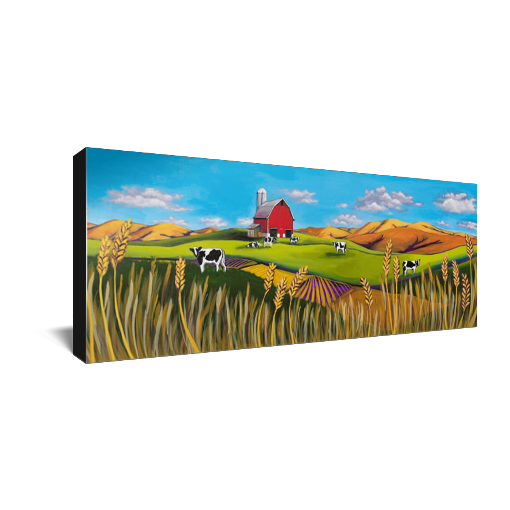 Archival print on canvas of a contemporary rural landscape painting of a red barn sitting in a green field with black and white dairy cows, wheat fields, and foothills under a bright blue sky with fluffy white clouds floating by. 