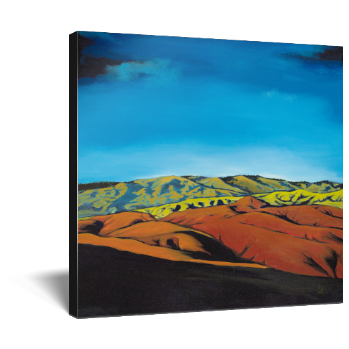 Archival print on canvas of a contemporary landscape painting of the scenic Boise, Idaho foothills in oranges and greens under a vivid blue sky. 